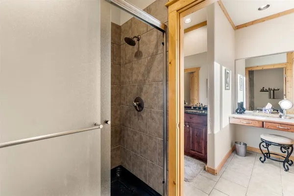 a bathroom with a shower and a sink