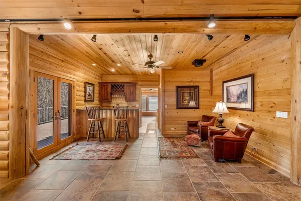 a lobby with furniture and a rug