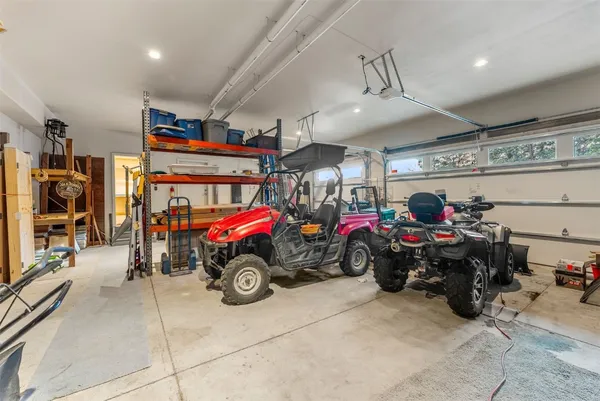 a view of a garage with a bike and car
