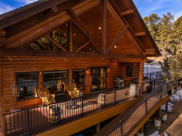 an outdoor view of a patio with table and chairs