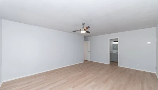 a large kitchen with stainless steel appliances granite countertop a large counter top a sink and a stove