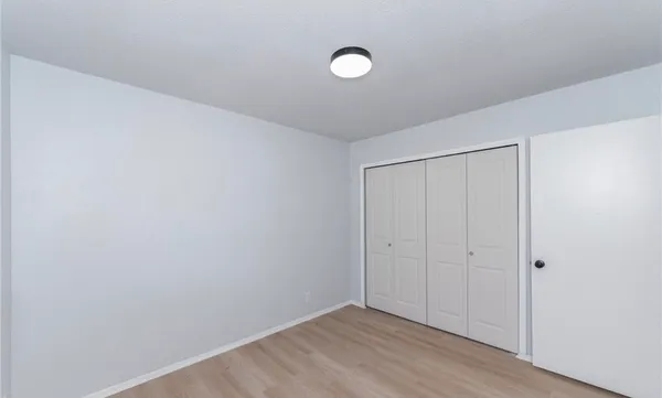 a bathroom with a toilet a sink a mirror and a bathtub