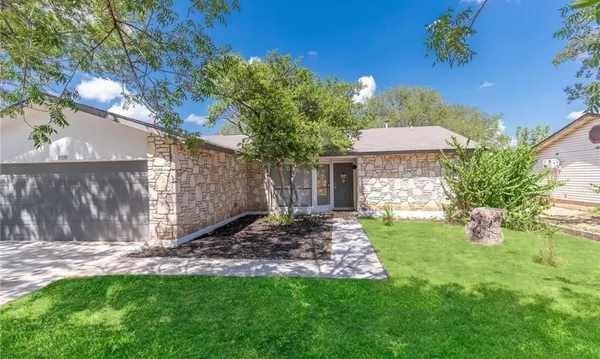 a view of a backyard with table and chairs and potted plants