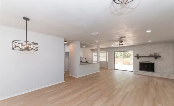 a view of a room with window and wooden floor