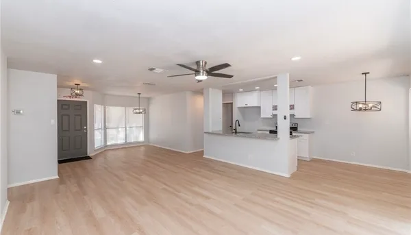 a bathroom with a sink toilet vanity and shower