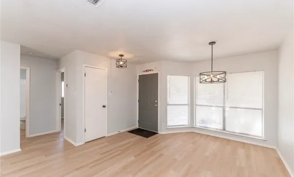 a view of large windows in an empty room