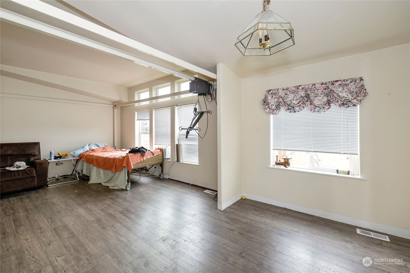 245 Griffith Farm Road Sequim, WA 98382 - Photo 22 of 33 a spacious bedroom with a bed and wooden floor