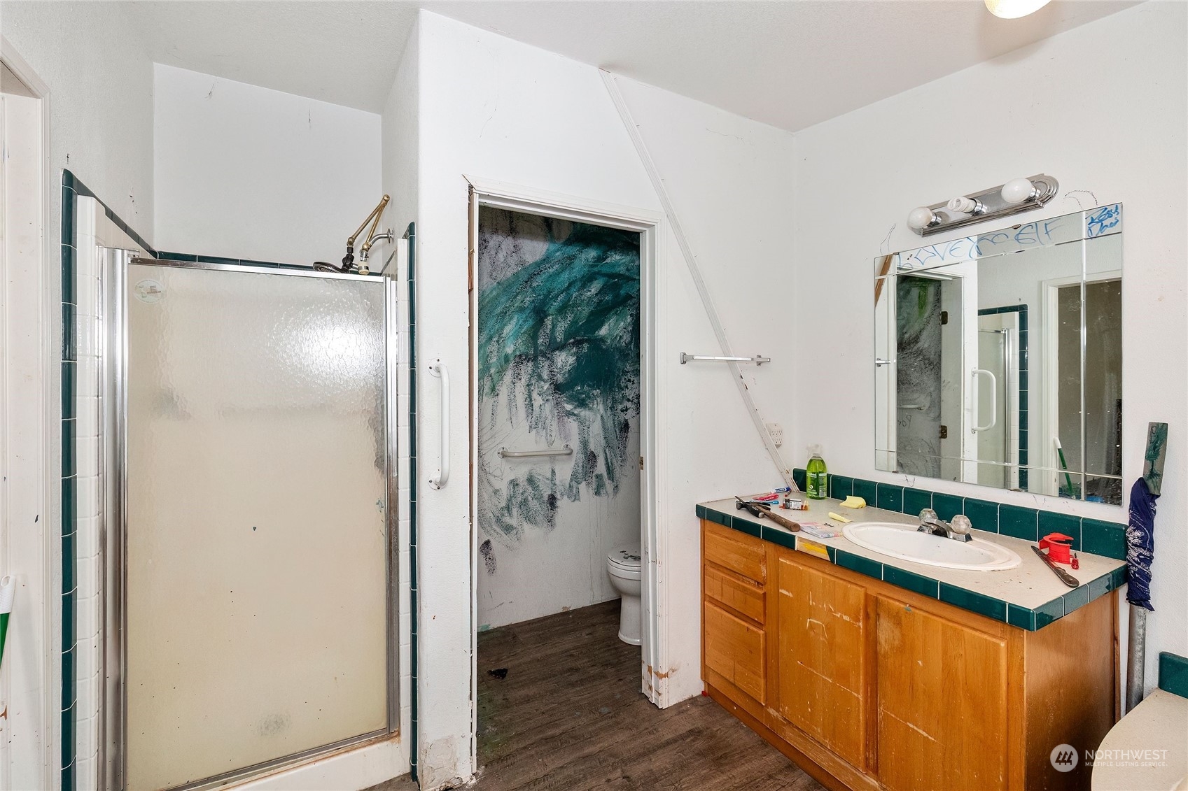 245 Griffith Farm Road Sequim, WA 98382 - Photo 27 of 33 a room that has a sink and a mirror