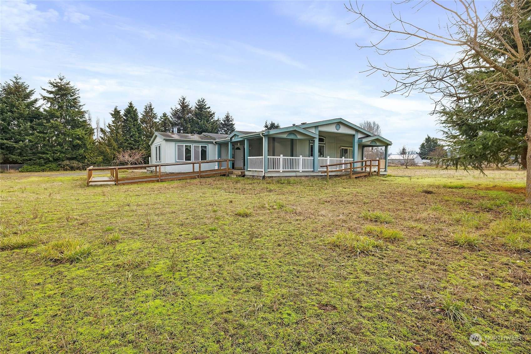 245 Griffith Farm Road Sequim, WA 98382 - Photo 3 of 33 a view of a lake with a house in the background