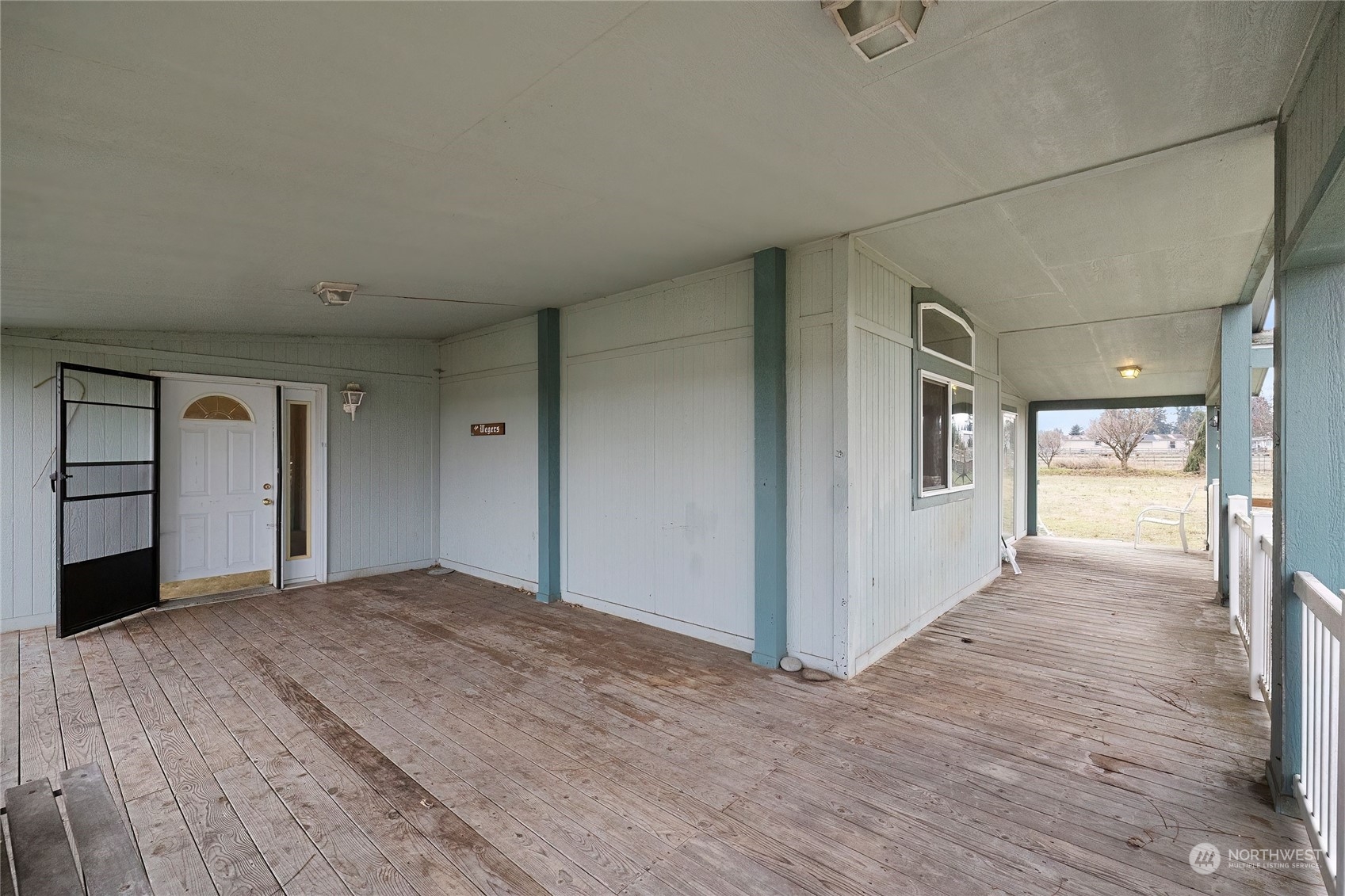 245 Griffith Farm Road Sequim, WA 98382 - Photo 9 of 33 a view of a big room with wooden floor and windows