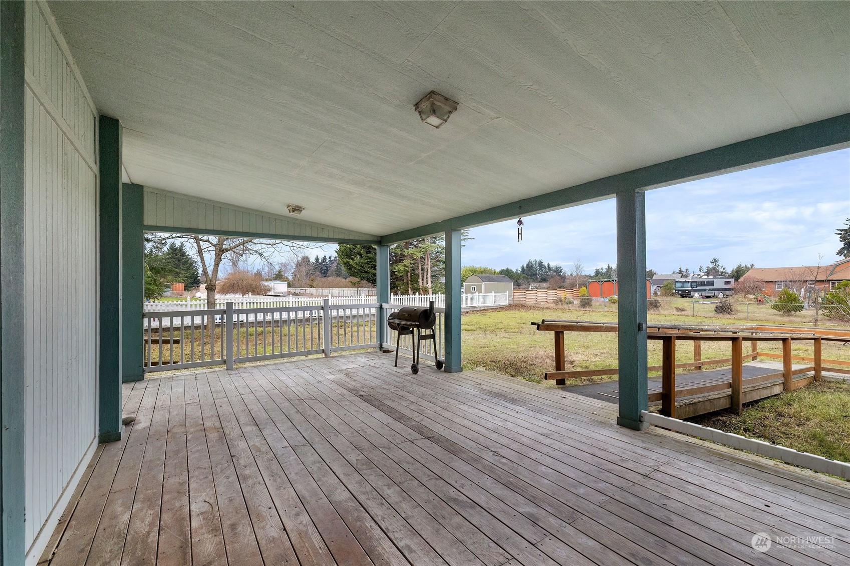 245 Griffith Farm Road Sequim, WA 98382 - Photo 10 of 33 a view of a living room and floor to ceiling window wooden floor
