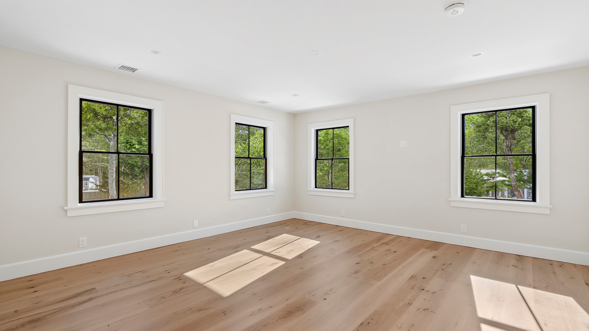 60 Kings Point Road East Hampton, NY 11937 - Photo 15 of 27 an empty room with wooden floor and windows