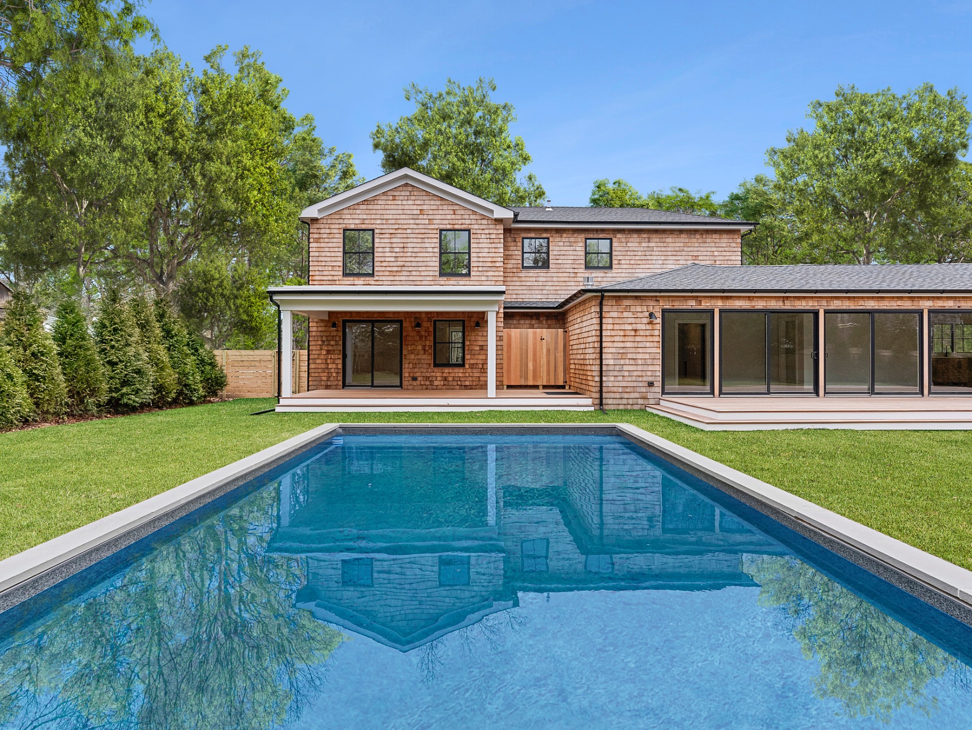 60 Kings Point Road East Hampton, NY 11937 - Photo 22 of 27 a house with swimming pool in front of it