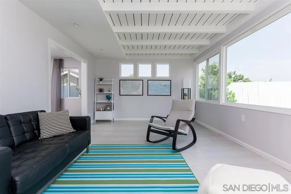 13617 Calais Drive Del Mar, CA 92014 - Photo 11 of 25 a living room with furniture and a wooden floor