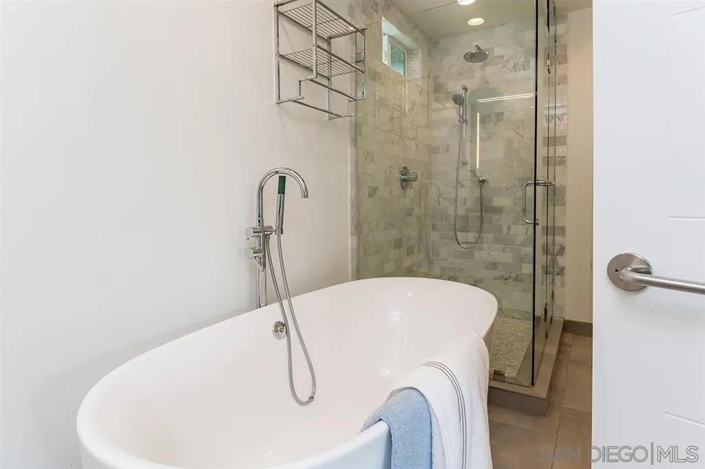 13617 Calais Drive Del Mar, CA 92014 - Photo 16 of 25 a bathroom with a sink a toilet and shower