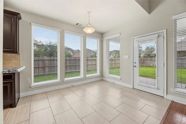 a view of an empty room with windows
