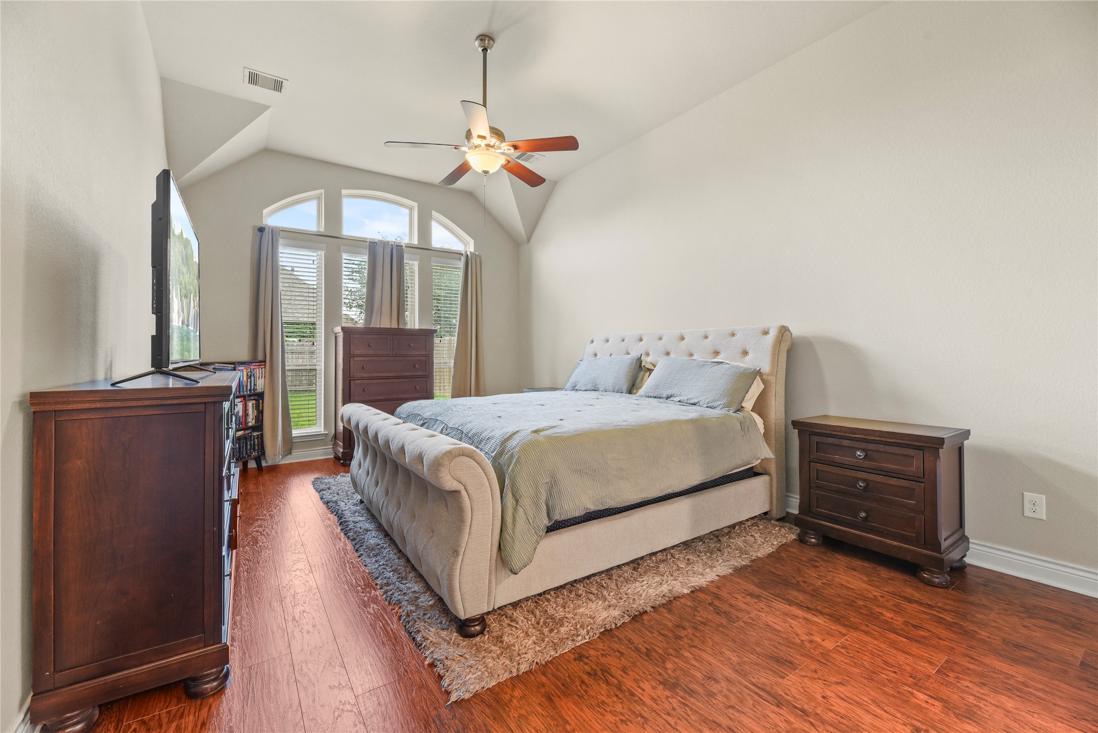 3834 Trophy Ridge Drive Spring, TX 77386 - Photo 21 of 43 a bedroom with a bed and wooden floor