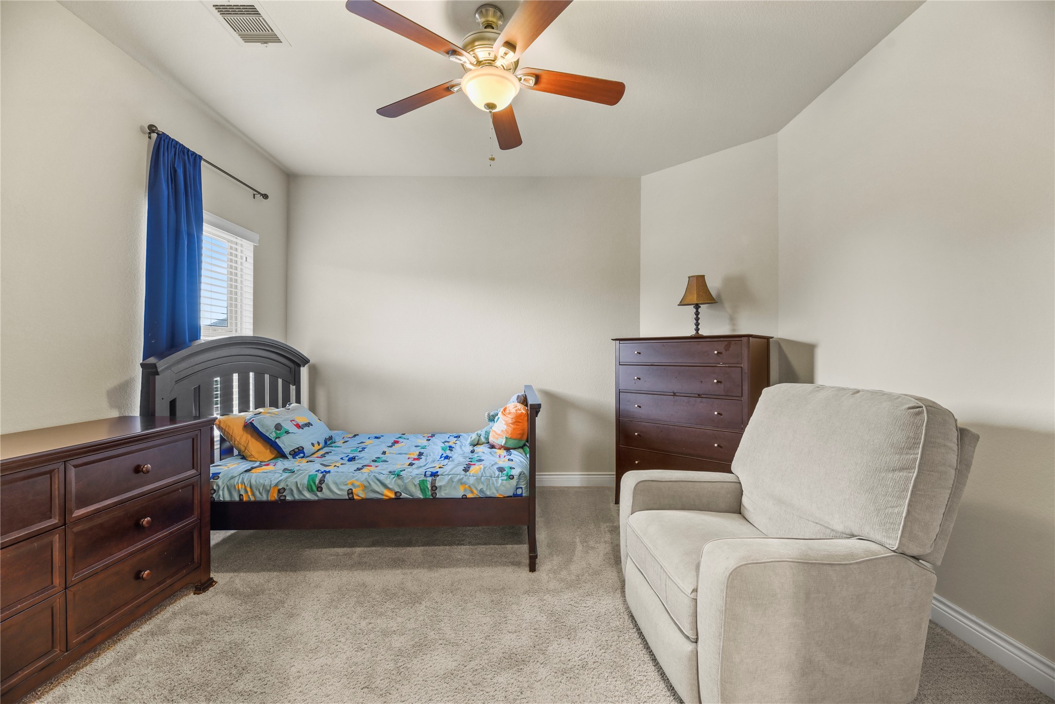 3834 Trophy Ridge Drive Spring, TX 77386 - Photo 32 of 43 a bedroom with furniture and a baby crib