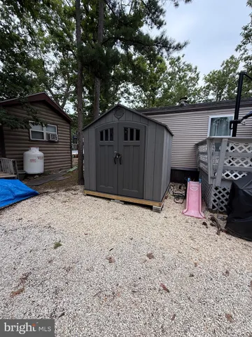 a view of a patio with table and chairs