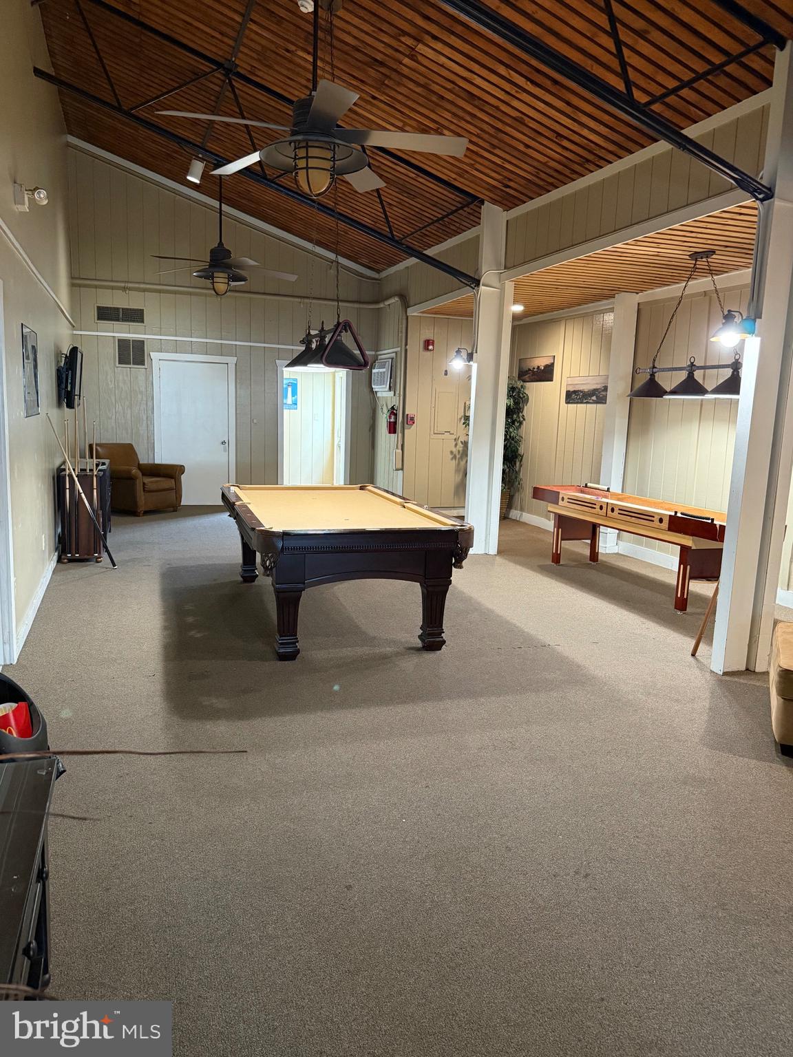515 Corsons Tavern Road, Unit F32 Ocean View, NJ 08230 - Photo 12 of 16 a view of a patio with table and chairs
