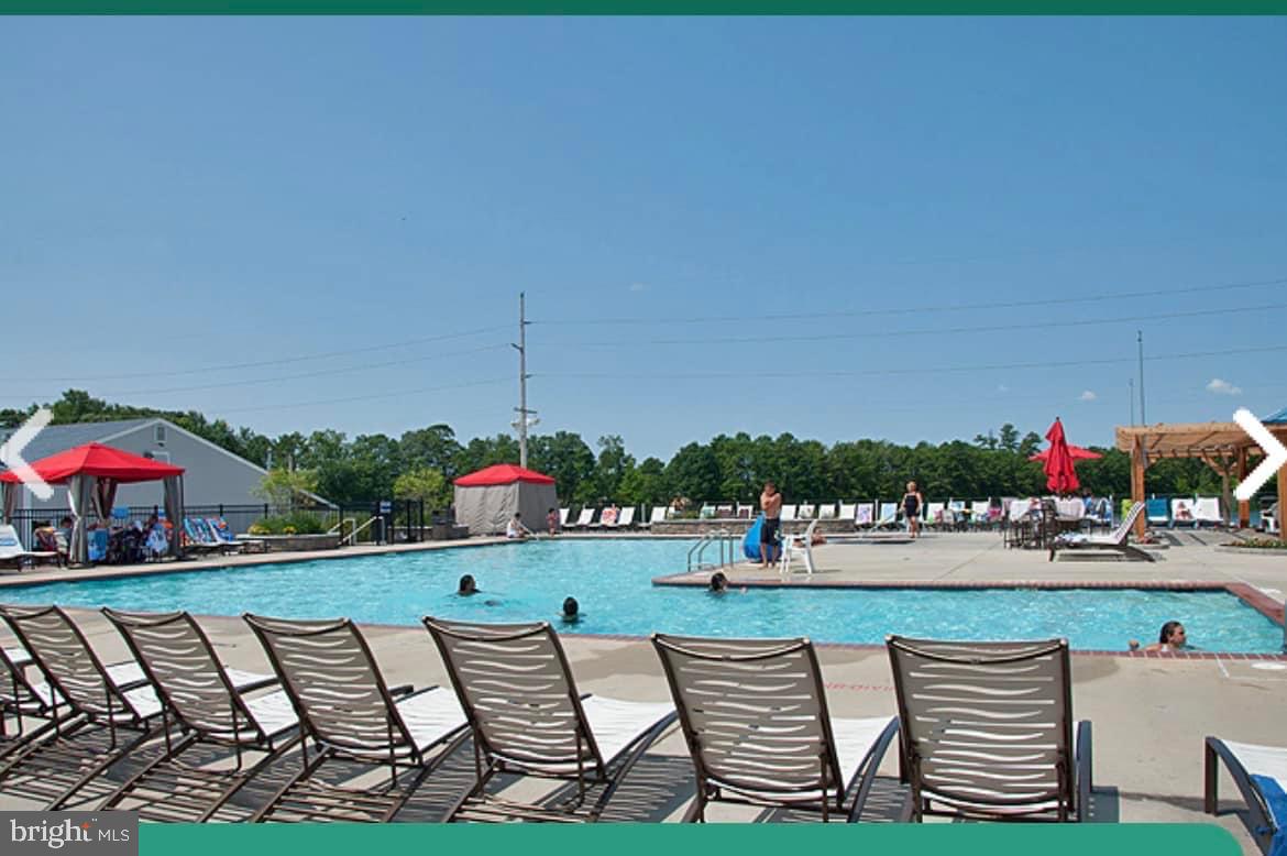 515 Corsons Tavern Road, Unit F32 Ocean View, NJ 08230 - Photo 13 of 16 swimming pool view with a seating space