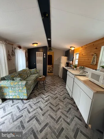 a large bedroom with a bed and furniture