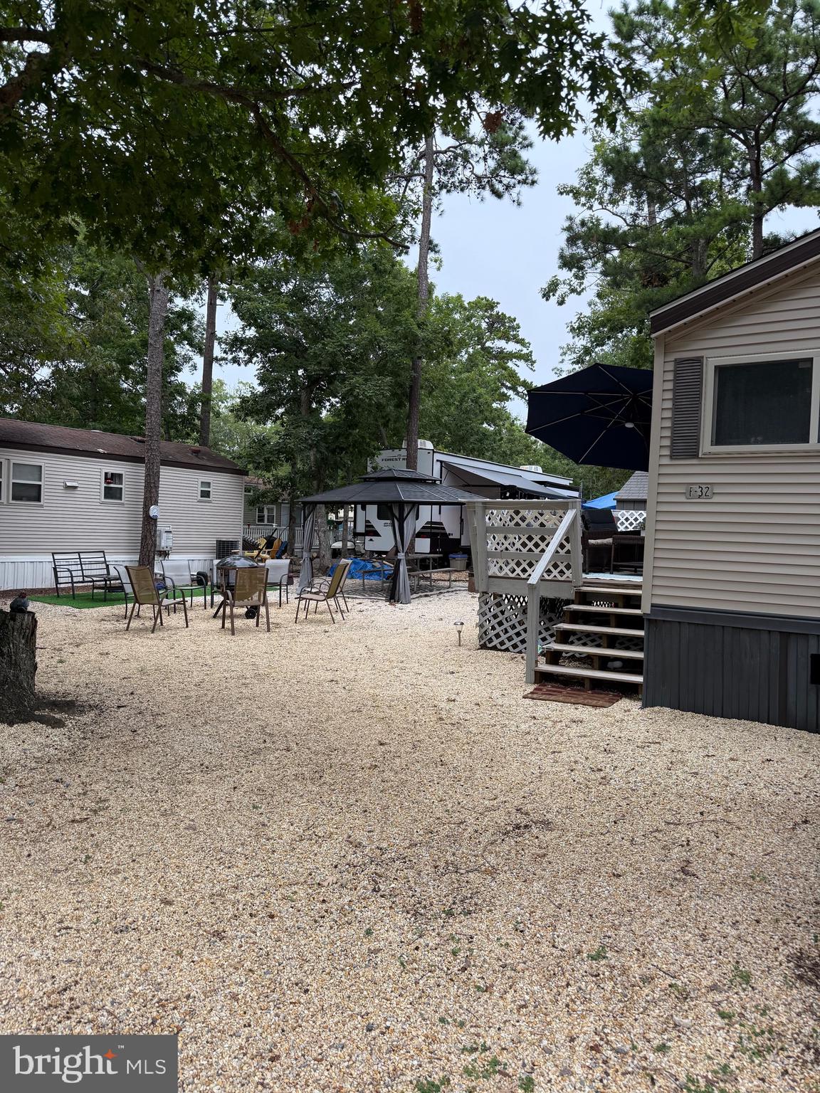 515 Corsons Tavern Road, Unit F32 Ocean View, NJ 08230 - Photo 3 of 16 a view of backyard and patio
