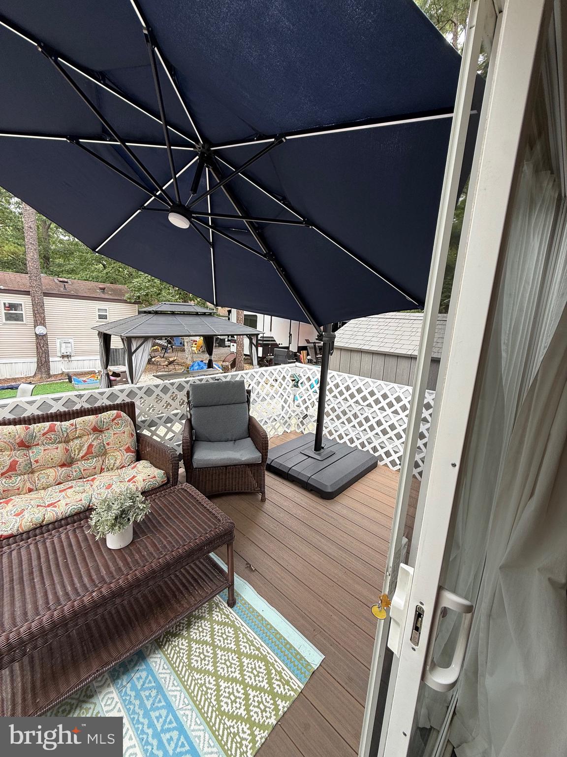 515 Corsons Tavern Road, Unit F32 Ocean View, NJ 08230 - Photo 7 of 16 a view of roof deck with table and chairs