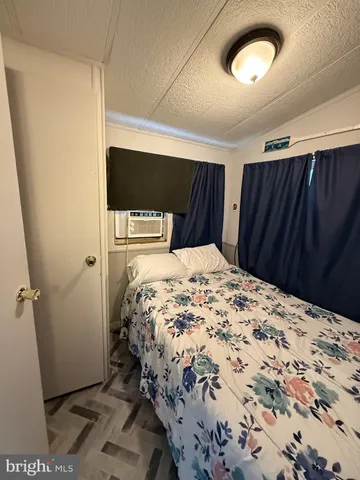 a white toilet sitting next to a bathroom sink and a shower