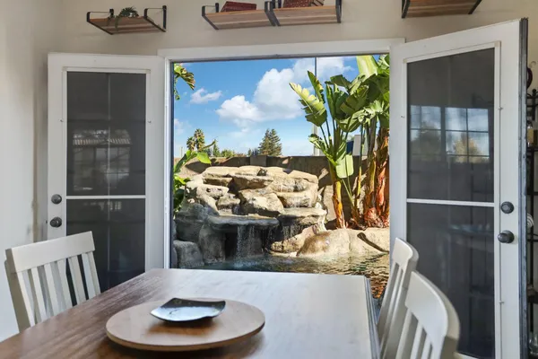 a view of a dining room with furniture window and wooden floor