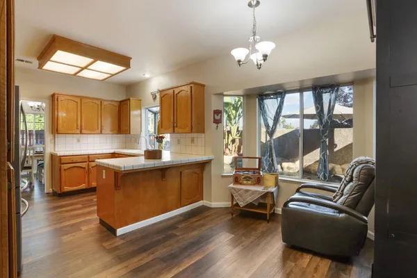a kitchen with a stove and a microwave