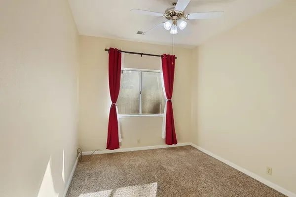a bedroom with furniture and a window
