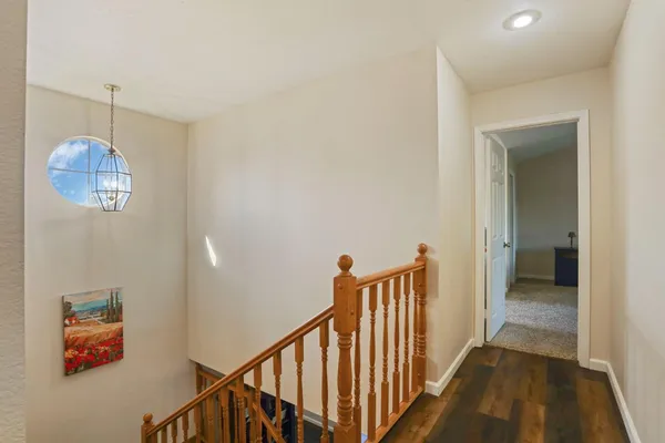 a view of walk in closet with clothes