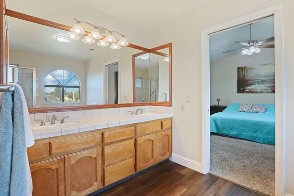 a bedroom with a bed and a book shelf