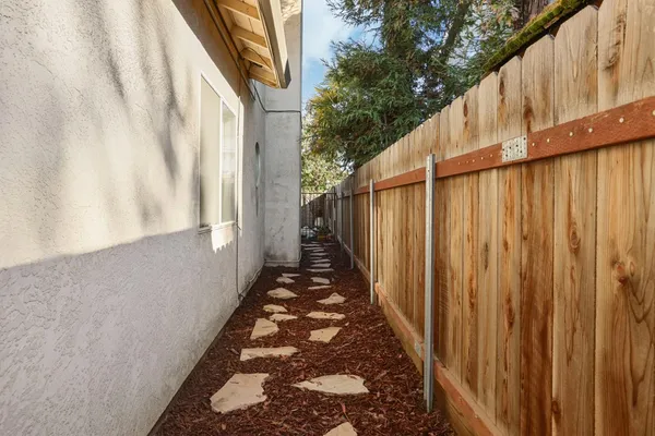 a backyard of a house with yard fire pit and outdoor seating
