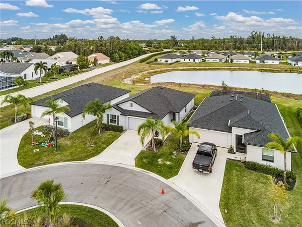 an aerial view of a house with a swimming pool