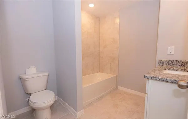 a bathroom with a toilet sink and bathtub