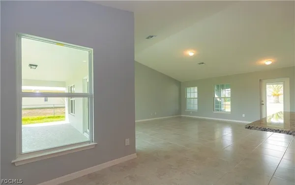 a view of an empty room and window