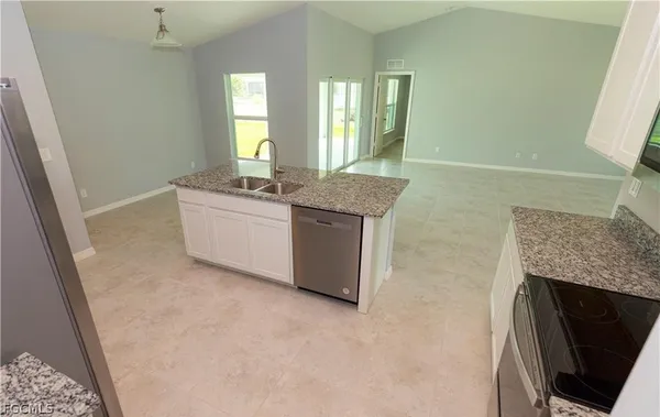 a room with a sink and a mirror