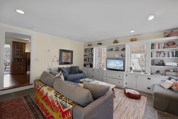 a living room with furniture and a flat screen tv