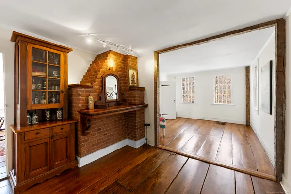 a view of a living room with wooden floor