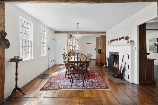 a view of a livingroom with a fireplace and furniture