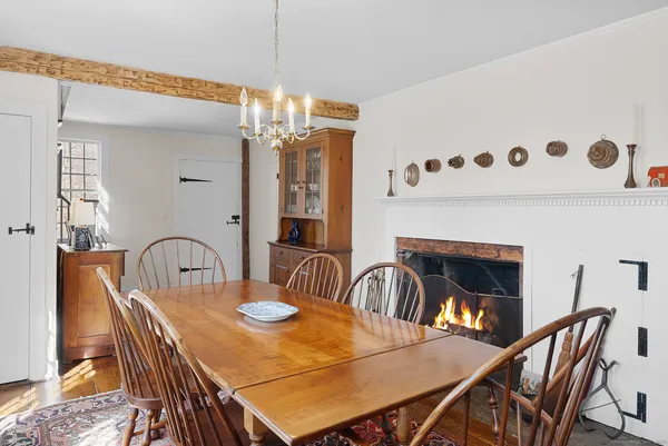 a dining room with furniture and window