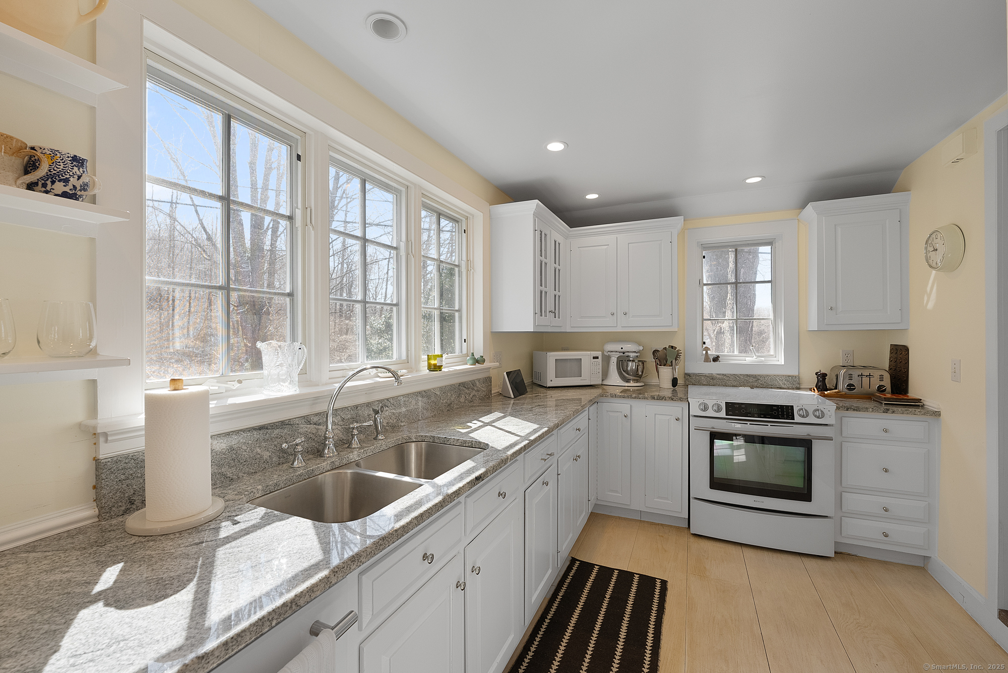 112 Chestnut Land Road New Milford, CT 06776 - Photo 17 of 32 a kitchen with a sink stove top oven and cabinets