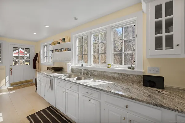 a kitchen with a sink and cabinets