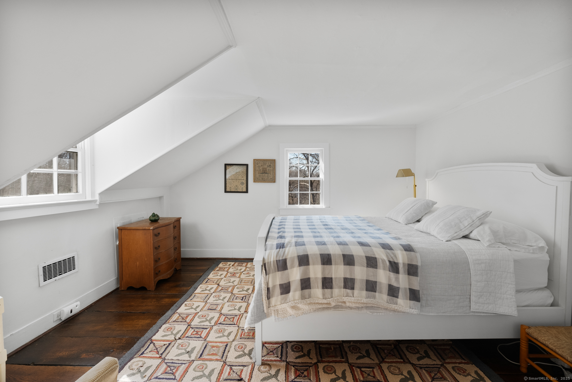 112 Chestnut Land Road New Milford, CT 06776 - Photo 23 of 32 a bedroom with a bed and wooden floor