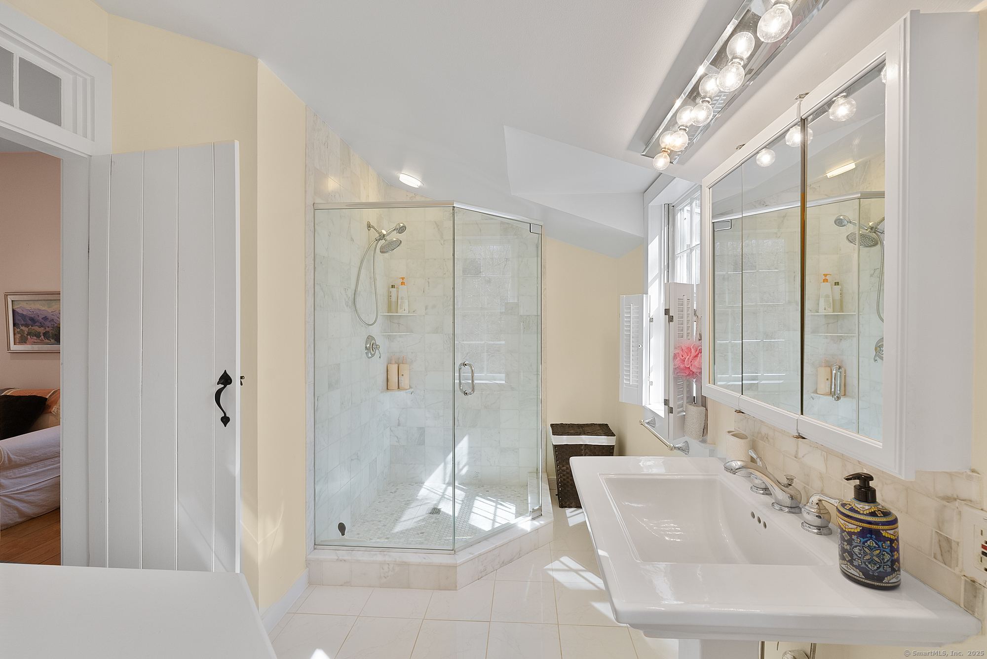 112 Chestnut Land Road New Milford, CT 06776 - Photo 28 of 32 a bathroom with a shower sink and mirror