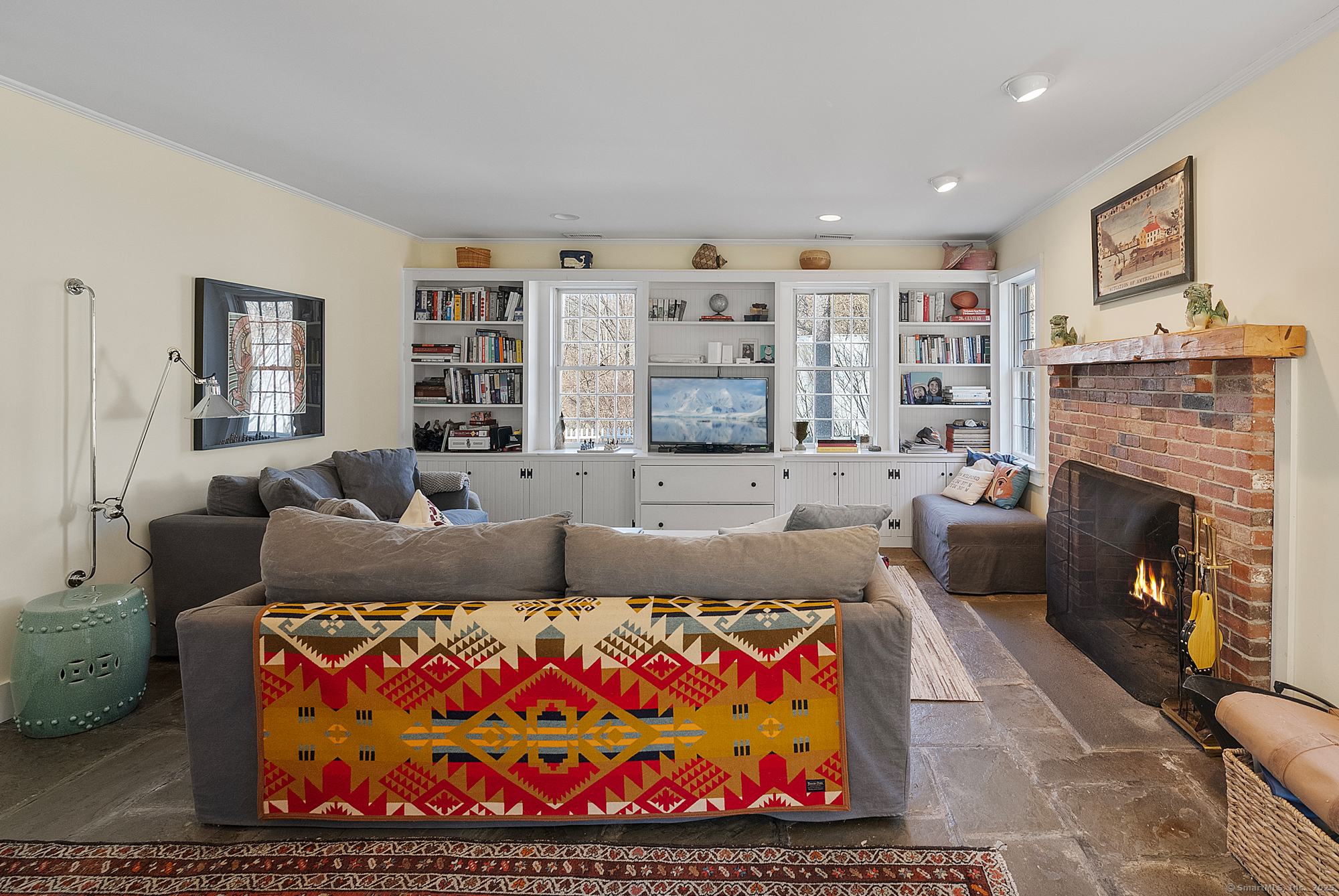 112 Chestnut Land Road New Milford, CT 06776 - Photo 9 of 32 a living room with furniture and a fireplace