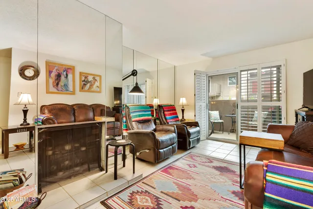 a living room with furniture and a gate