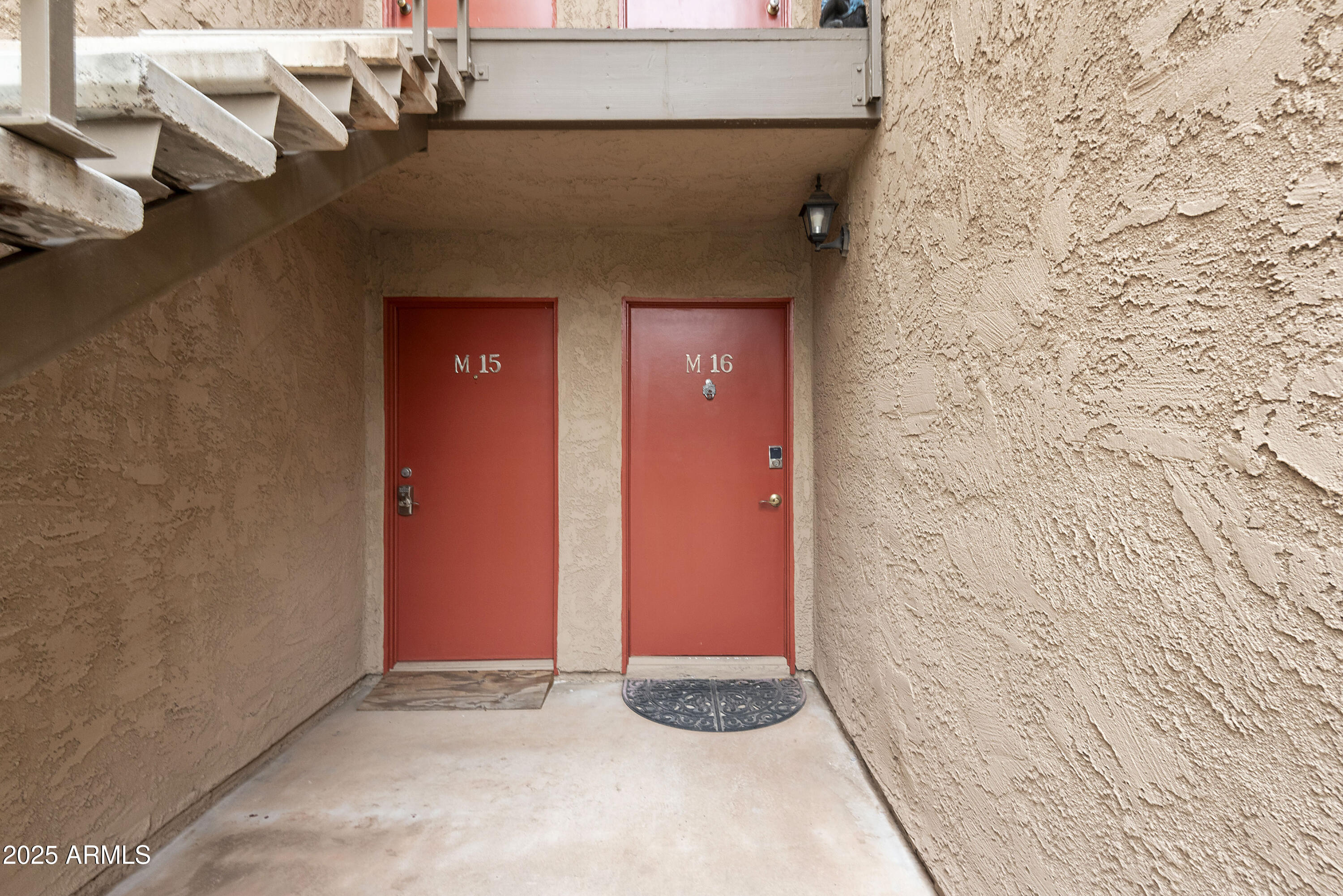 5525 East Thomas Road, Unit M16 Phoenix, AZ 85018 - Photo 2 of 27 a view of a wooden door